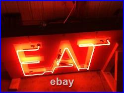 Vintage neon EAT sign. Two sided red neon on metal sign. Both sides work