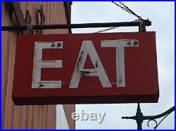 Vintage neon EAT sign. Two sided red neon on metal sign. Both sides work